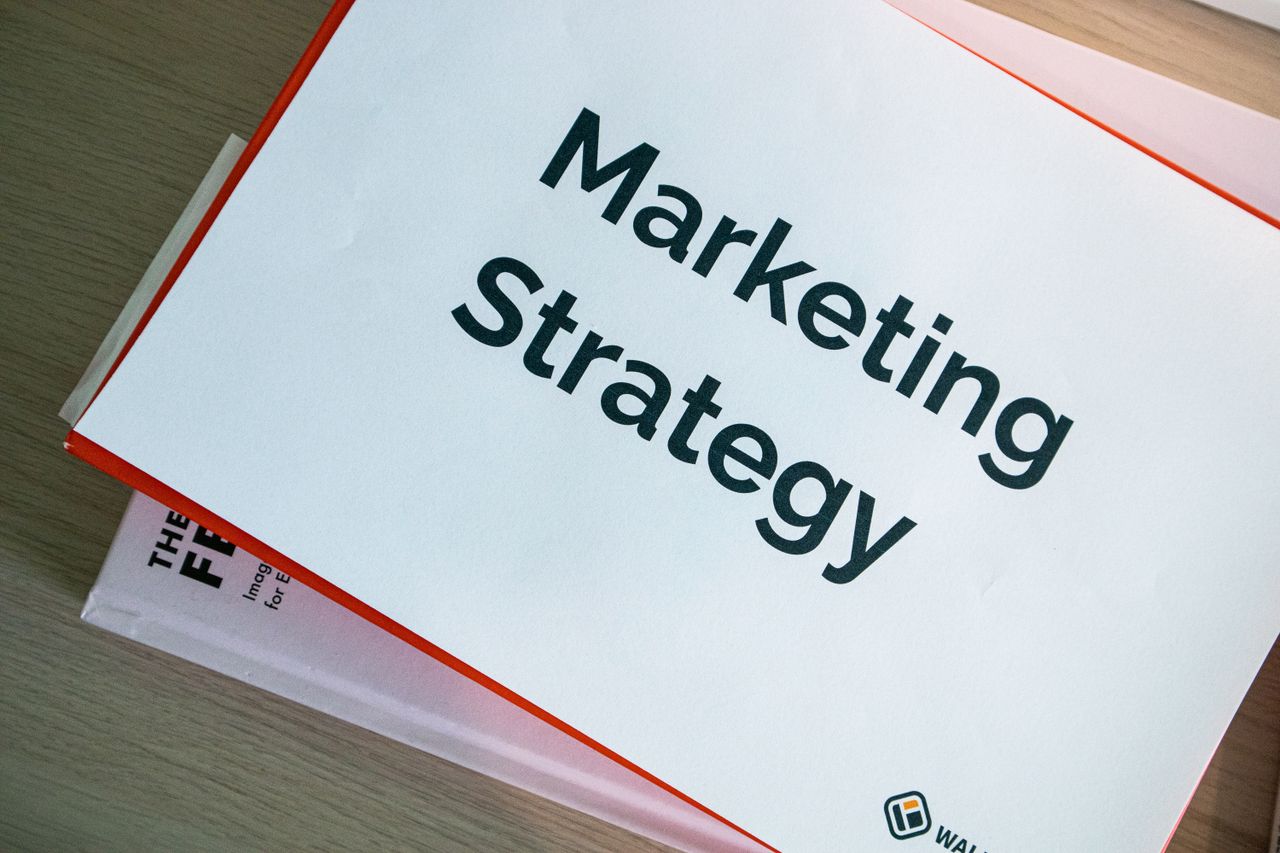services-05 A marketing strategy document displayed on a desk, showcasing business planning essentials.